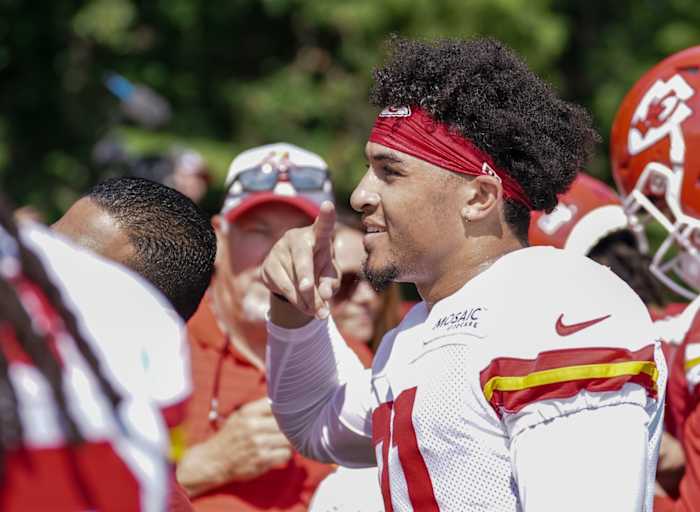 Jul 27, 2022; St. Joseph, MO, USA; Kansas City Chiefs wide cornerback Trent McDuffie (21) poses for a photo with fans after training camp at Missouri Western University. Mandatory Credit: Denny Medley-USA TODAY Sports